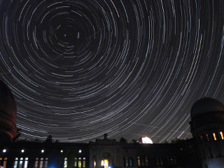 Starry night at Yerkes: Can you find the satellite in this time-lapse photo of the night sky over Yerkes Observatory in Williams Bay, Wisconsin?